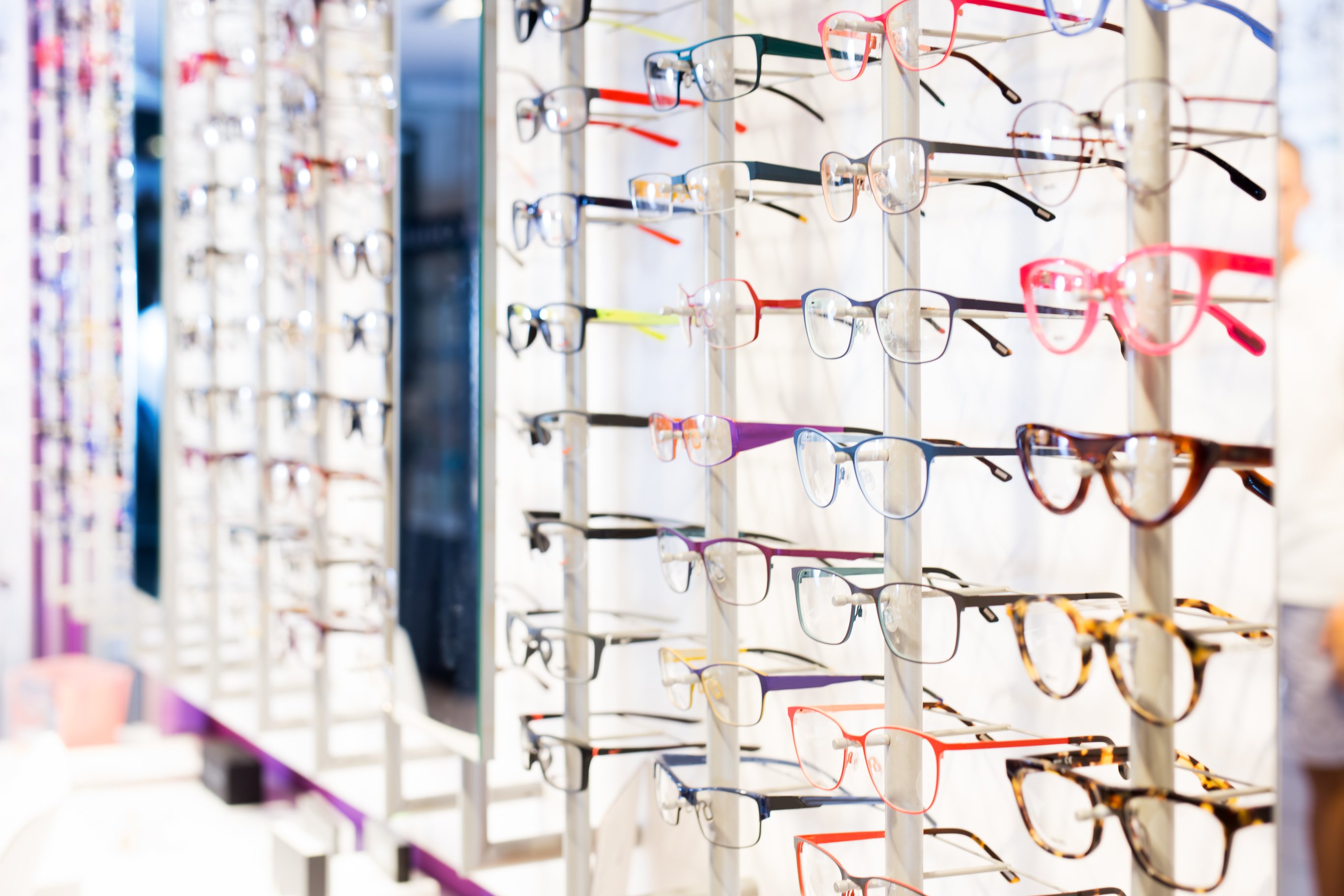 Glasses showcase in modern optic shop